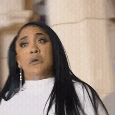 Woman With Long Black Hair In White Sweater And Earrings GIF