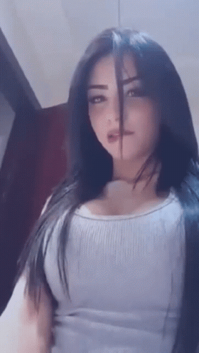 Woman With Long Black Hair In White Tank Top GIF