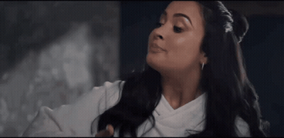 Woman With Long Black Hair In White Top GIF