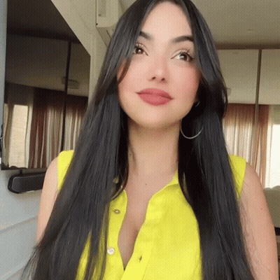 Woman With Long Black Hair In Yellow Shirt GIF