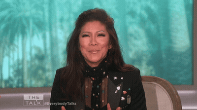 Woman With Long Black Hair Looking At Camera GIF