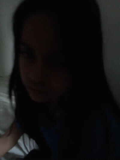 Woman With Long Black Hair Lying On Bed Eyes Closed GIF