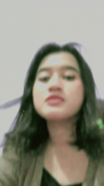 Woman With Long Black Hair Making Funny Face GIF