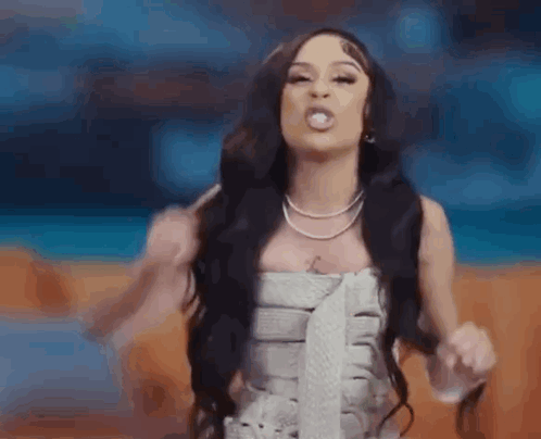 Woman With Long Black Hair Making Funny Face GIF
