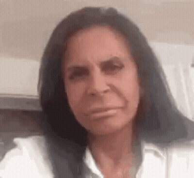 Woman With Long Black Hair Making Funny Face GIF