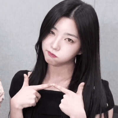 Woman With Long Black Hair Making Funny Face With Fingers GIF