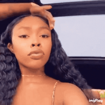 Woman With Long Black Hair Sitting In Car Person Touching Hair GIF