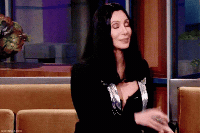 Woman With Long Black Hair Sitting On Couch GIF