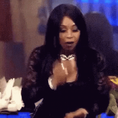 Woman With Long Black Hair Sitting With Hands Folded GIF