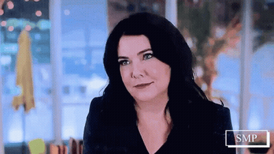Woman With Long Black Hair Smiling At Camera GIF