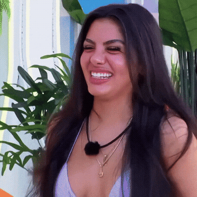 Woman With Long Black Hair Smiling In White Top GIF