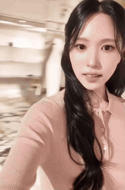 Woman With Long Black Hair Taking Selfie GIF