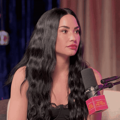 Woman With Long Black Hair Talking Into Babylon Microphone GIF