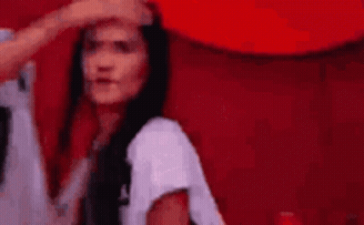 Woman With Long Black Hair Touched By Man's Hand On Forehead GIF