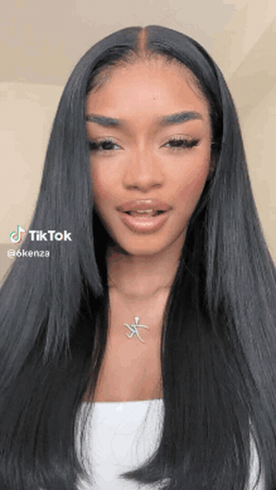 Woman With Long Black Hair Wearing White Top And Necklace GIF
