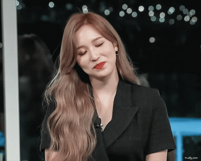 Woman With Long Blonde Hair And Black Shirt GIF