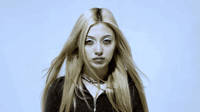 Woman With Long Blonde Hair And Choker Necklace GIF