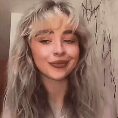 Woman With Long Blonde Hair And Wall Drawing GIF