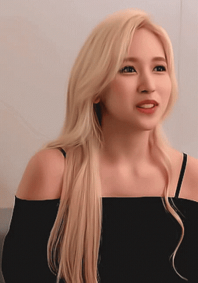 Woman With Long Blonde Hair In Black Off Shoulder Top GIF