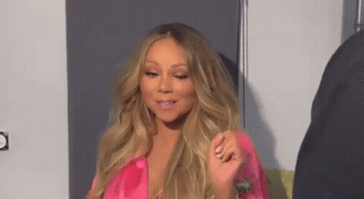 Woman With Long Blonde Hair In Pink Satin Robe GIF