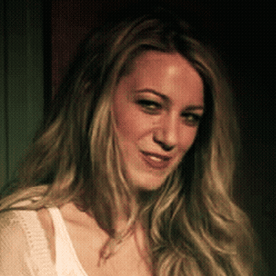Woman With Long Blonde Hair In White Tank Top GIF