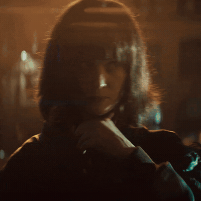Woman With Long Blonde Hair Looking At Camera GIF