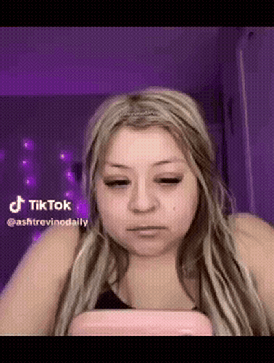 Woman With Long Blonde Hair Looking At Phone GIF