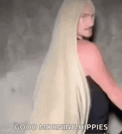 Woman With Long Blonde Hair Standing GIF