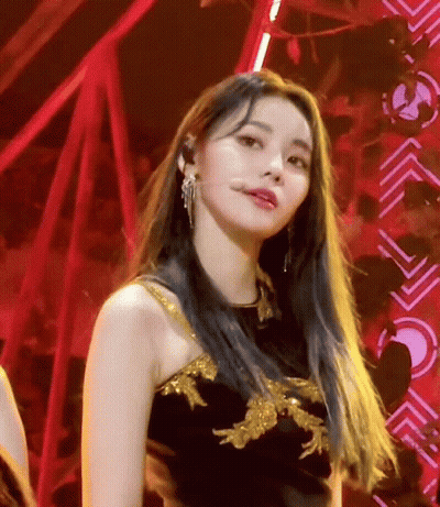 Woman With Long Blue Hair In Black And Gold Dress GIF