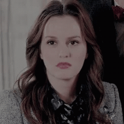 Woman With Long Brown Hair And Grey Jacket GIF
