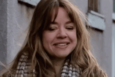 Woman With Long Brown Hair And Tattoo GIF
