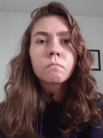 Woman With Long Brown Hair Making Face GIF