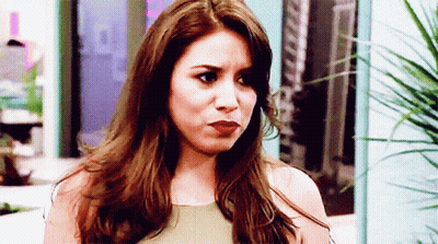 Woman With Long Brown Hair Making Serious Face GIF