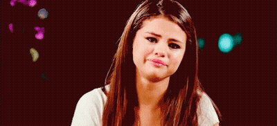 Woman With Long Brown Hair Smiling Making Funny Face GIF