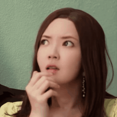 Woman With Long Brown Hair Surprised Hand To Mouth GIF