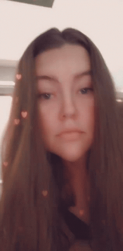 Woman With Long Brown Hair Taking Selfie With Hearts GIF
