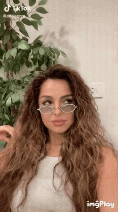 Woman With Long Curly Hair And Sunglasses GIF