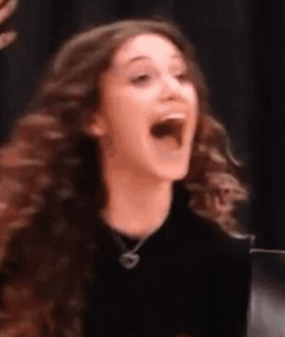 Woman With Long Curly Hair Laughing GIF