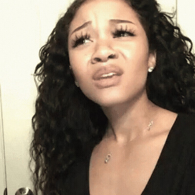 Woman With Long Curly Hair Making Funny Face GIF