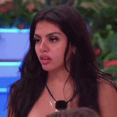 Woman With Long Dark Hair And Necklace GIF
