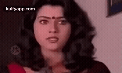 Woman With Long Dark Hair and Red Bindi Looking at Camera
