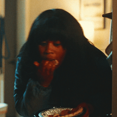 Woman With Long Dark Hair Eating GIF