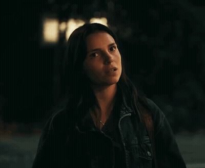 Woman With Long Dark Hair In Denim Jacket GIF