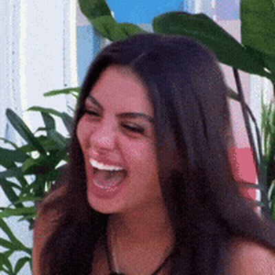 Woman With Long Dark Hair Laughing Open-Mouthed GIF