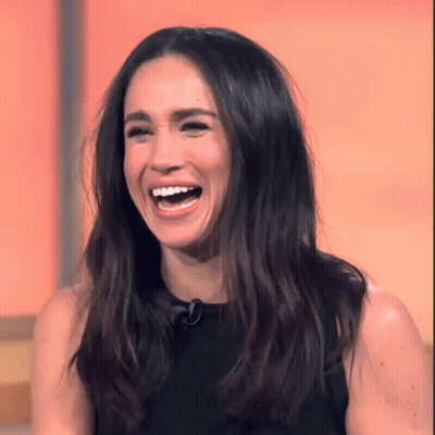 Woman With Long Dark Hair Laughing With Mouth Open GIF
