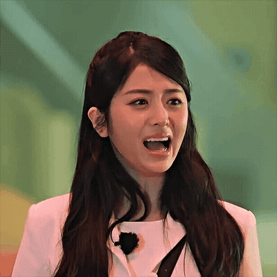 Woman With Long Dark Hair Making Funny Face GIF