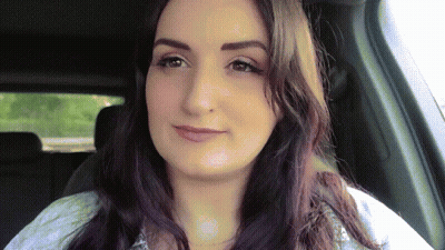 Woman With Long Dark Hair Sitting In Car GIF