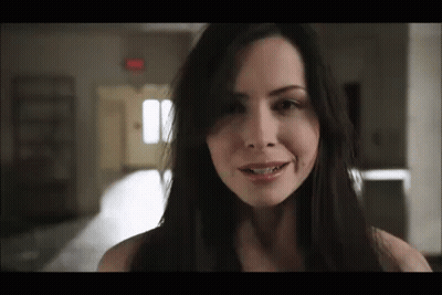 Woman With Long Dark Hair Smiling GIF