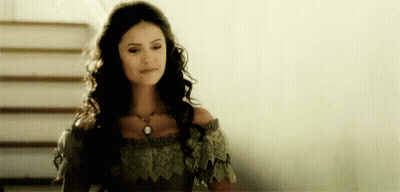 Woman With Long Dark Hair Standing GIF