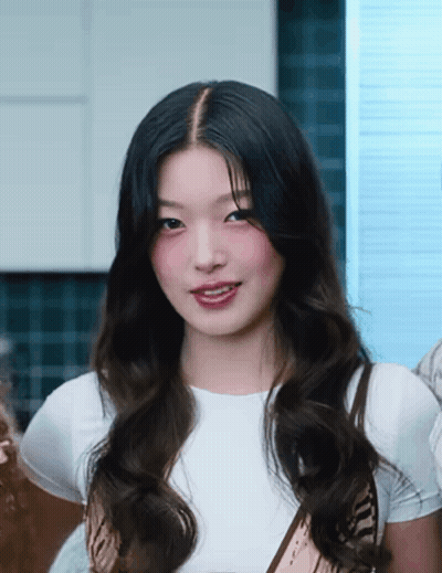 Woman With Long Dark Hair Wearing White Shirt And Scarf GIF